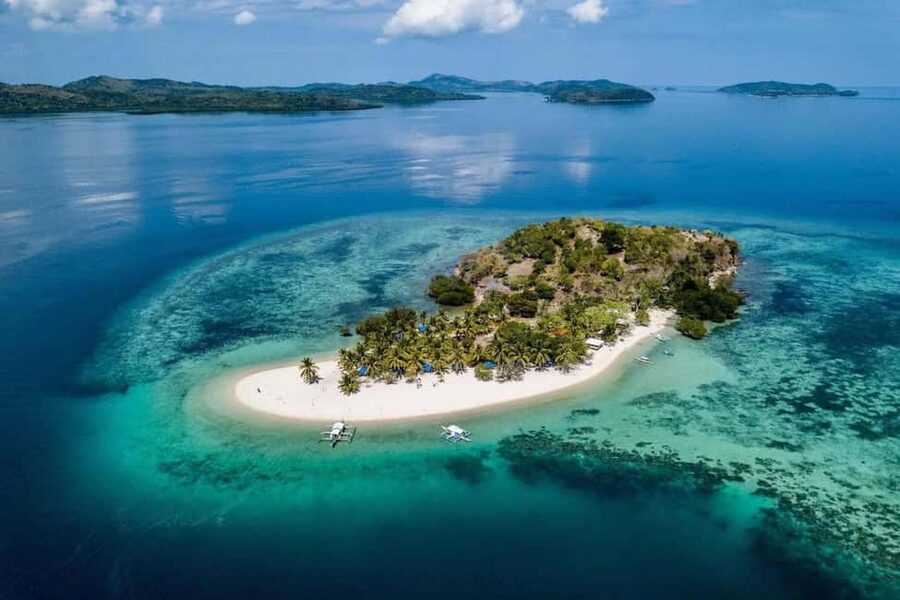 Coron: Reefs and Wrecks Tour with Snorkeling Equipment - Lusong Coral Garden and its schools of fish