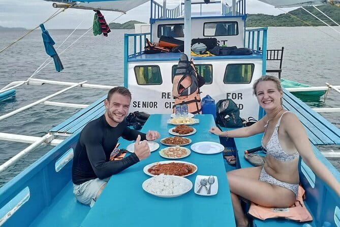 El Nido Group Tour A with Beach Lunch - Seven Commando Beach: palms, swimming, and lunch
