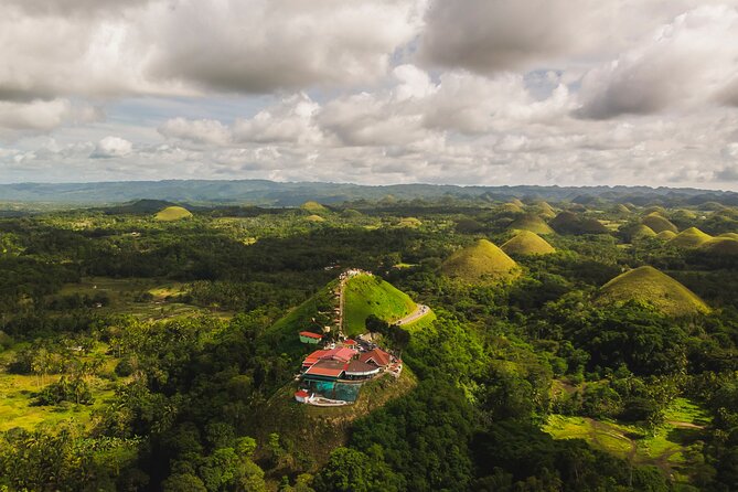 Famous Bohol Chocolate Hills Loboc River Cruise Tarsier Tour - Baclayon Church: coral stone and colonial craftsmanship
