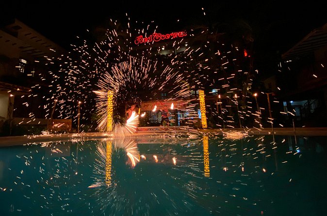 Fire Dancing Show At Red Coconut Beach Hotel - Food, drinks, and the practical value of the ticket