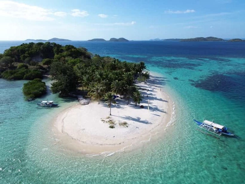 From Coron: Explore Busuanga Beach Escapade - South Cay combines lunch, sand, and snorkeling