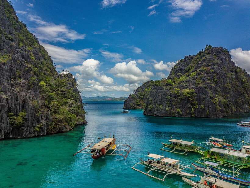 From Coron: Island Hopping Boat Day Trip with Buffet Lunch - The crew, language, and pace