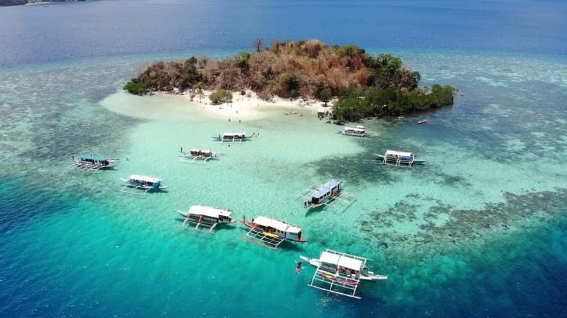 From Coron: Island Hopping Boat Day Trip with Buffet Lunch - Kayangan Lake: Coron’s famous freshwater stop