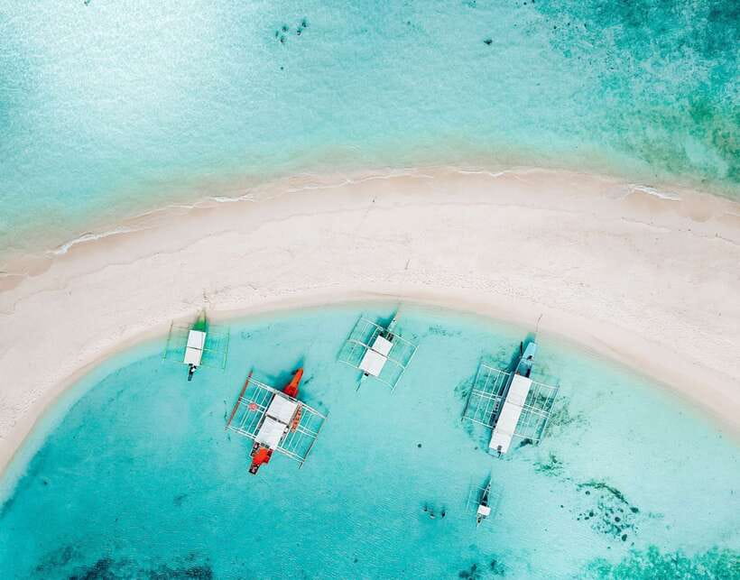 From Coron: Private Island-Hopping Cruise with Lunch - A picnic lunch with fruit and drinking water