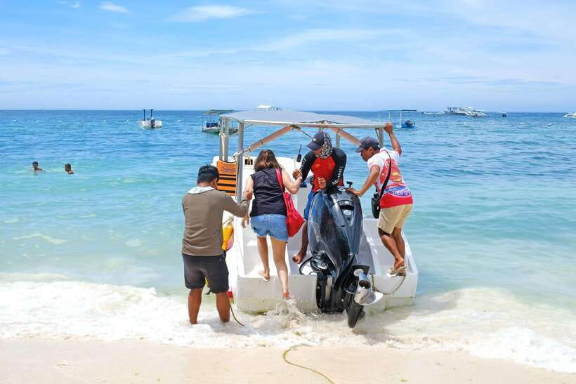 Panglao: Solo or Tandem Parasailing Experience near Alona - Getting ready with safety gear